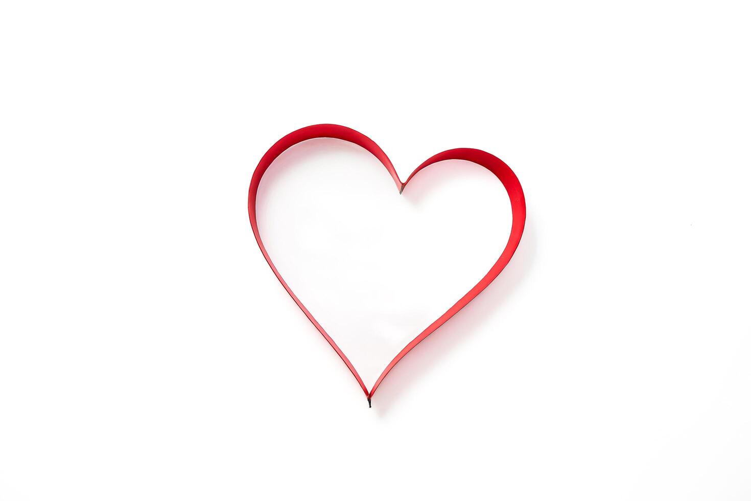 Red Heart Shape on White Background photo