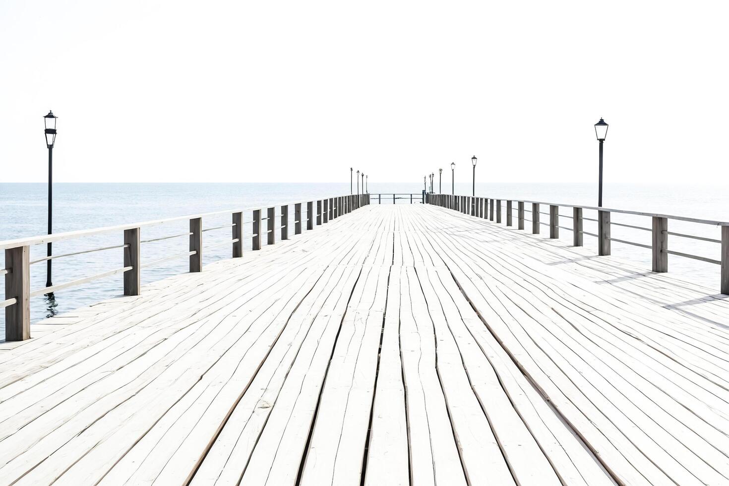 Wooden pier leading to the horizon photo