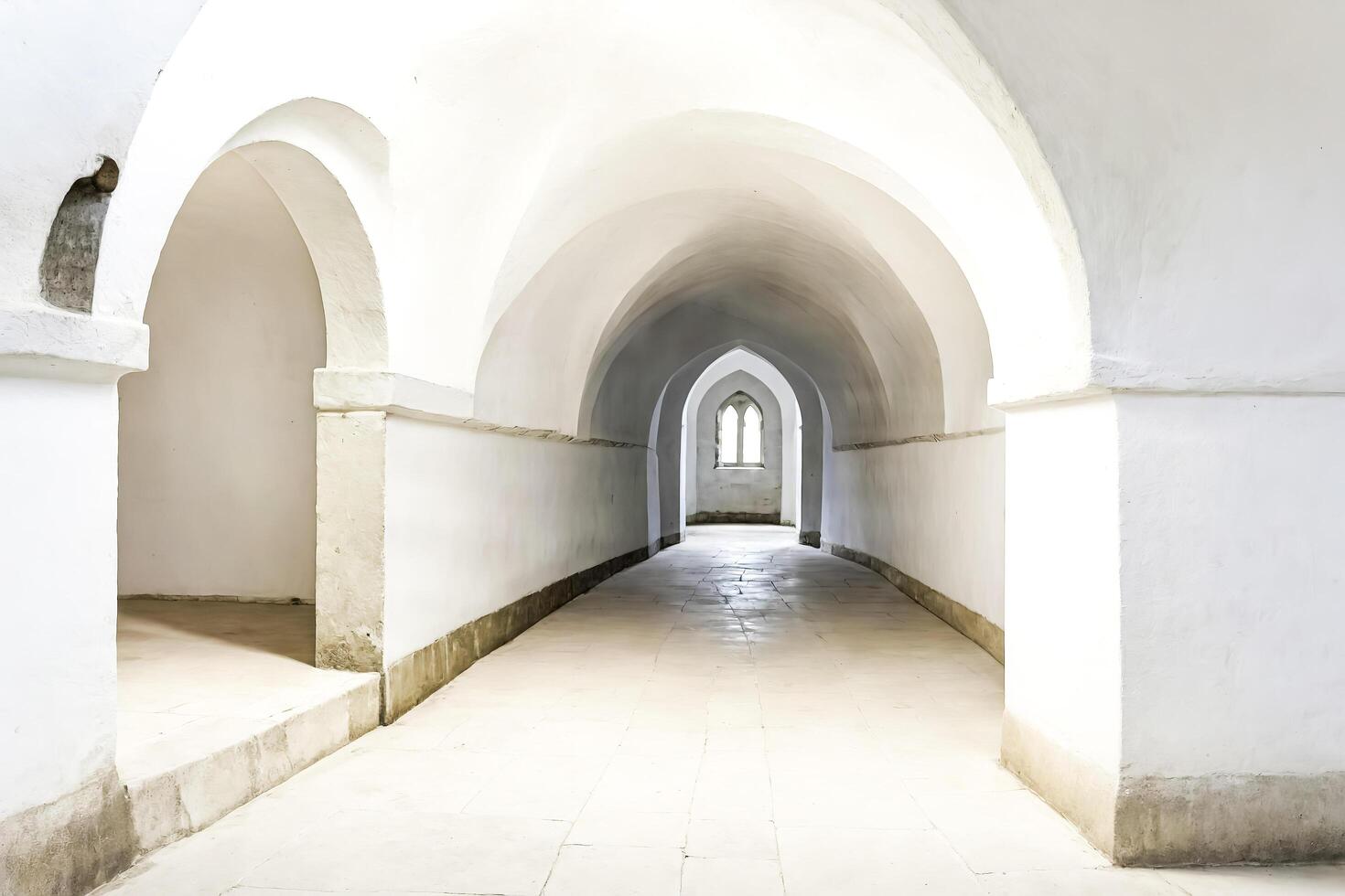 White Arched Corridor with Light at the End photo