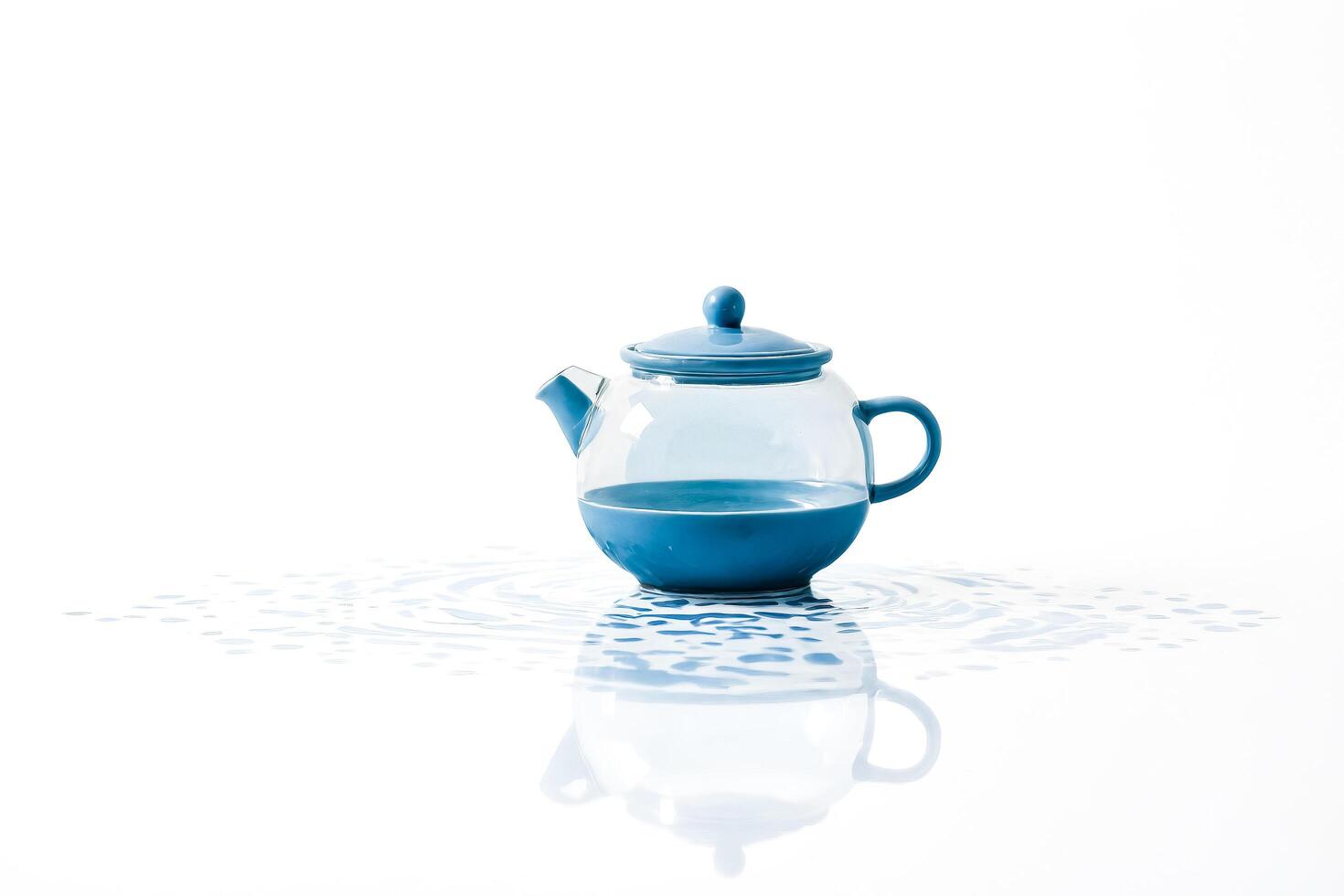 Blue Teapot Floating on Water photo