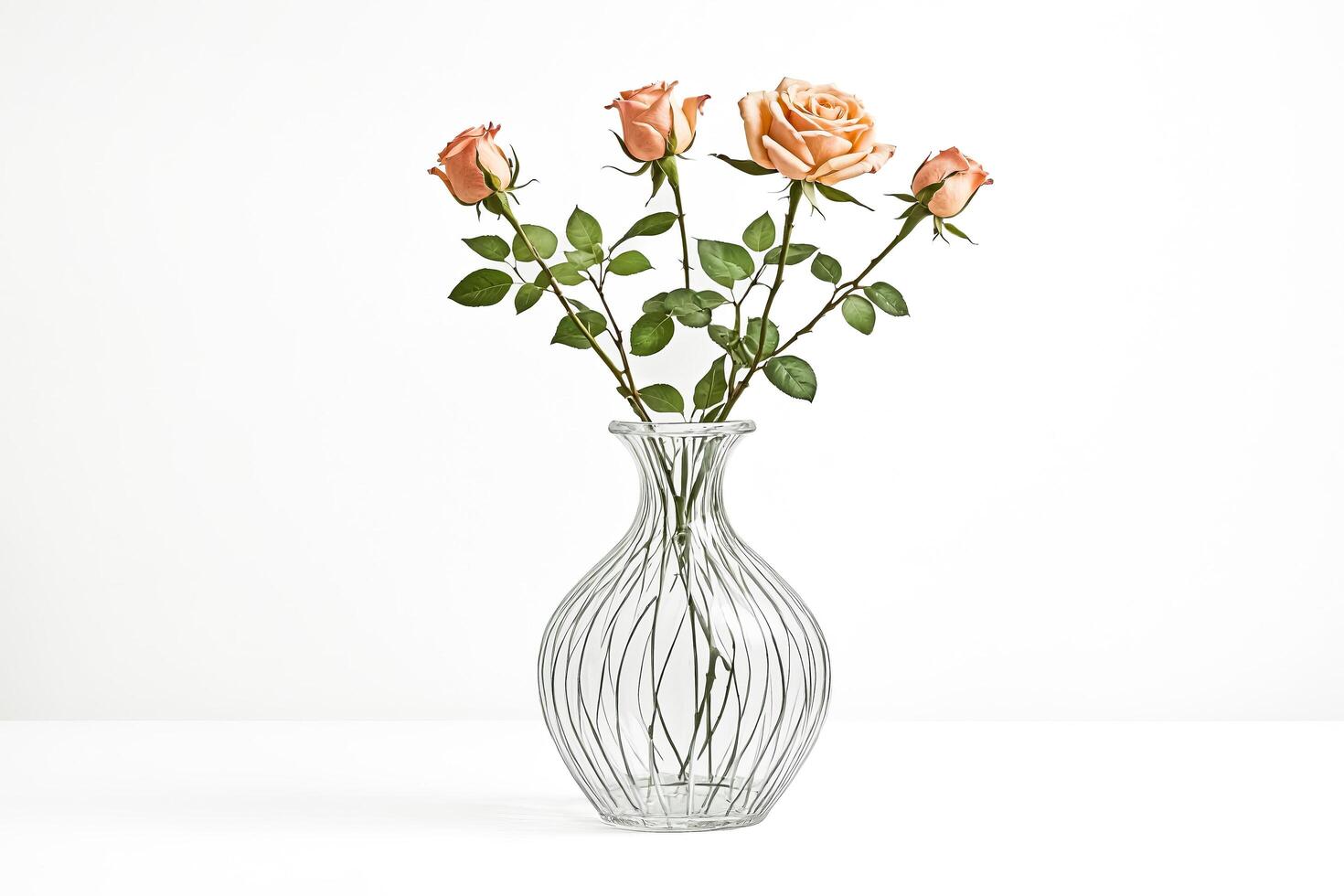 Peach Roses in a Clear Glass Vase photo