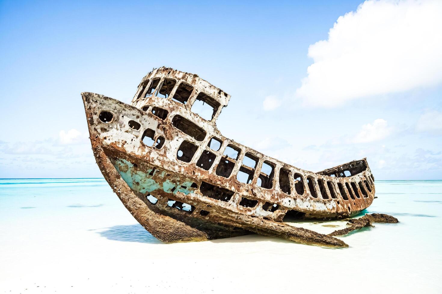 Shipwreck on a tropical beach photo