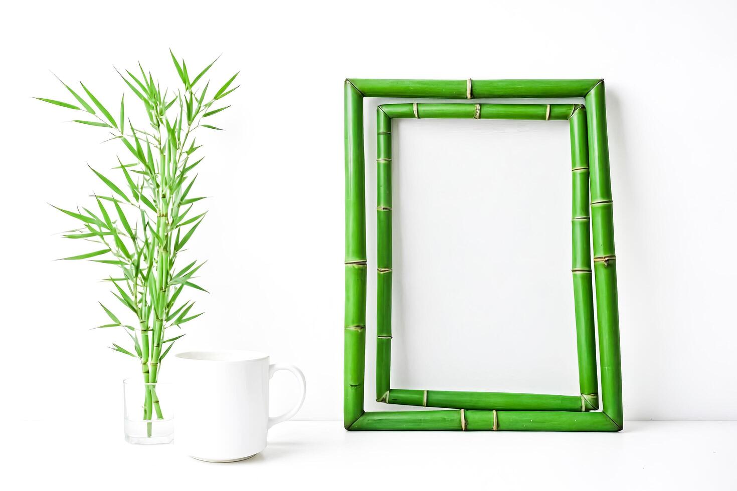 Bamboo Frame with a Cup of Tea and a Plant on a White Background photo