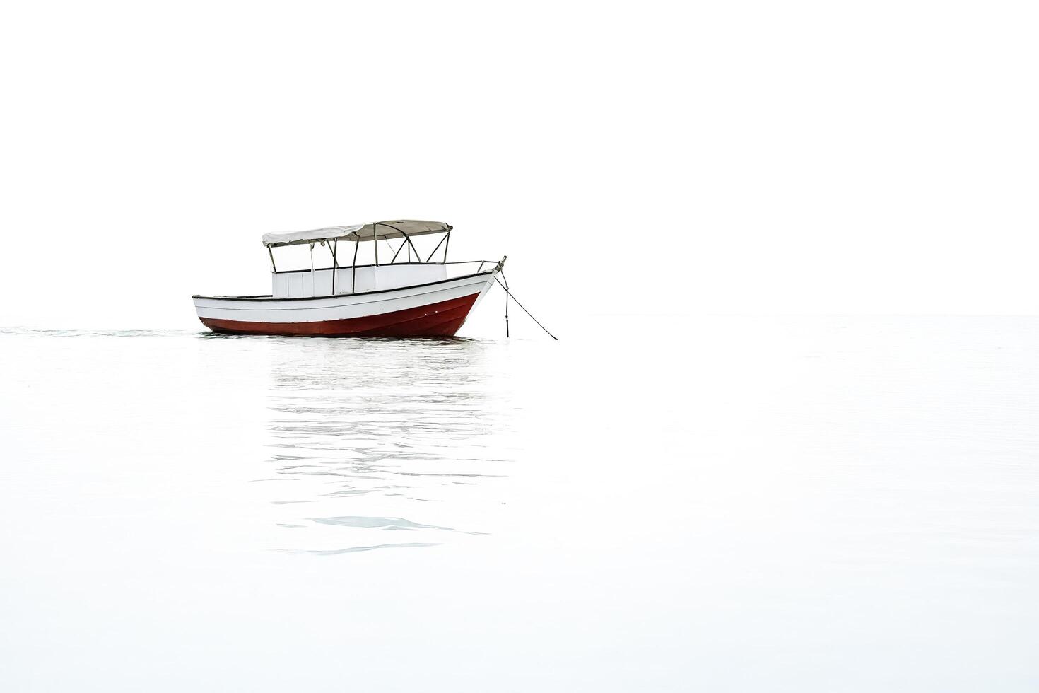 Small Boat on Calm Water photo