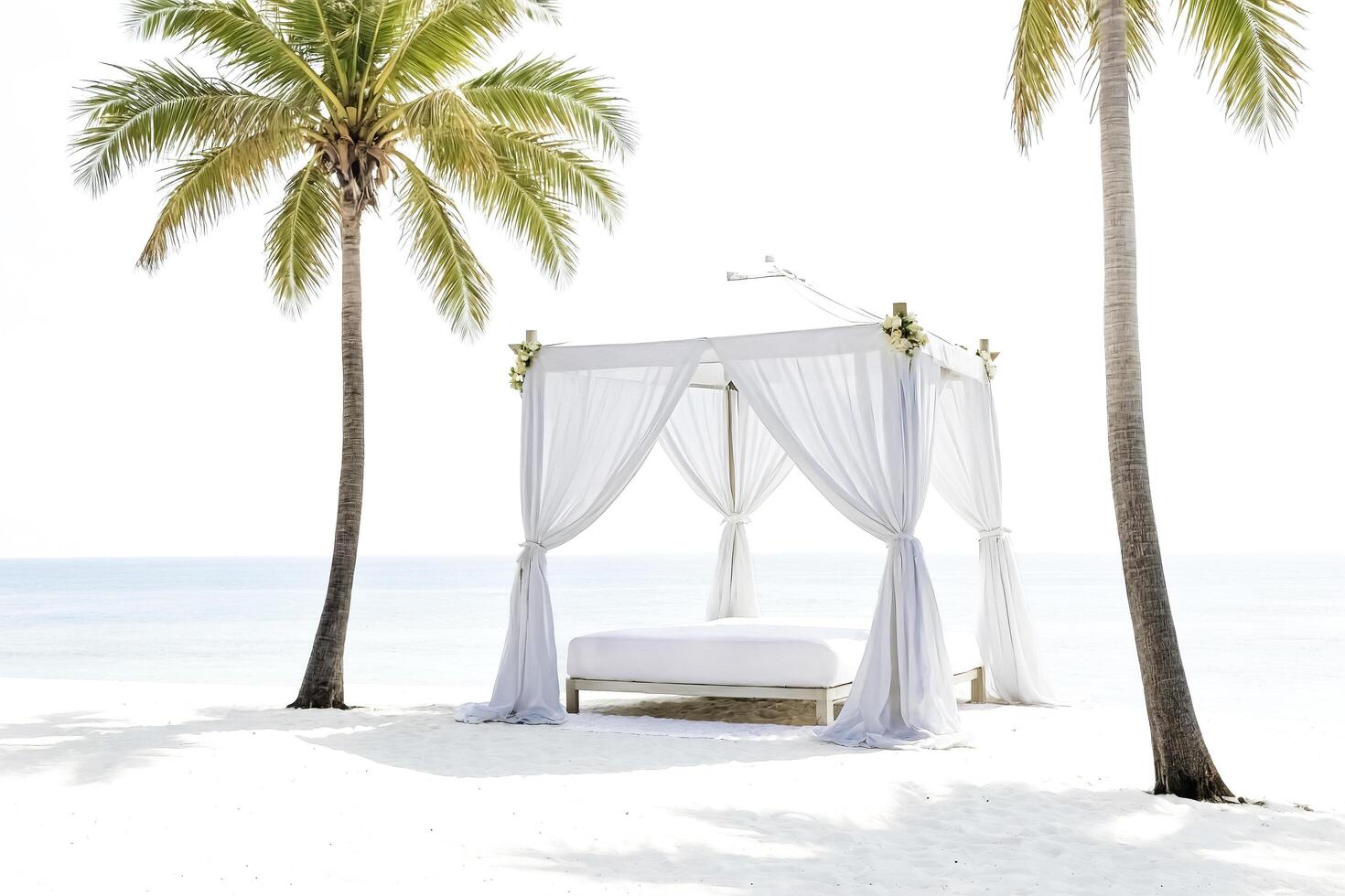 White canopy bed on a tropical beach photo