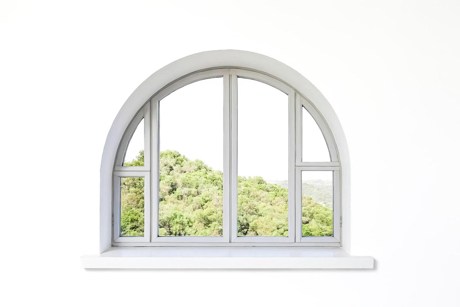 Arched Window with View of Green Trees photo