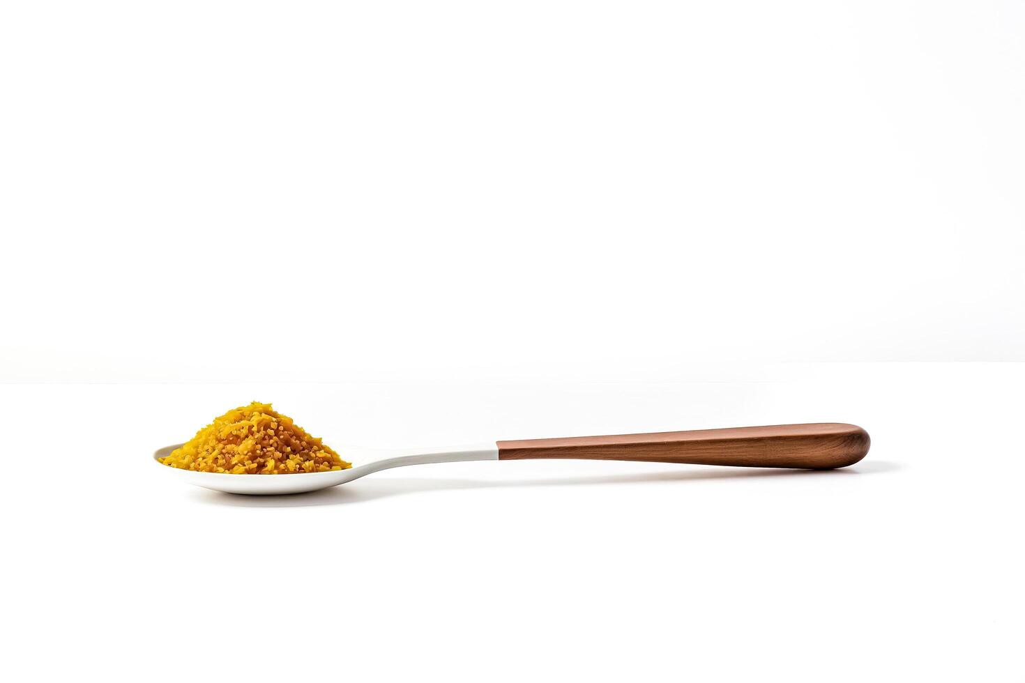 Spoon with Turmeric Powder on White Background photo