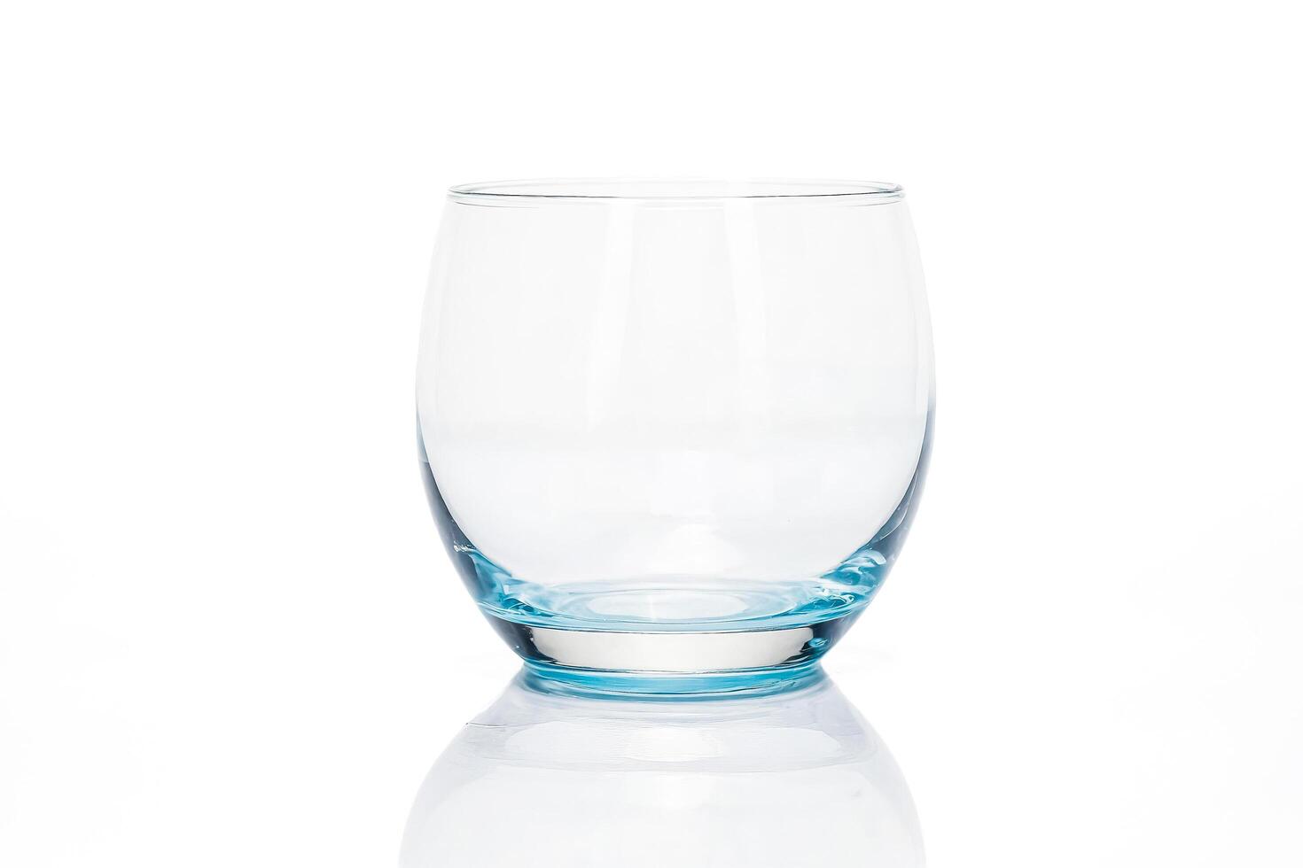 Empty Glass With Blue Base On White Background photo