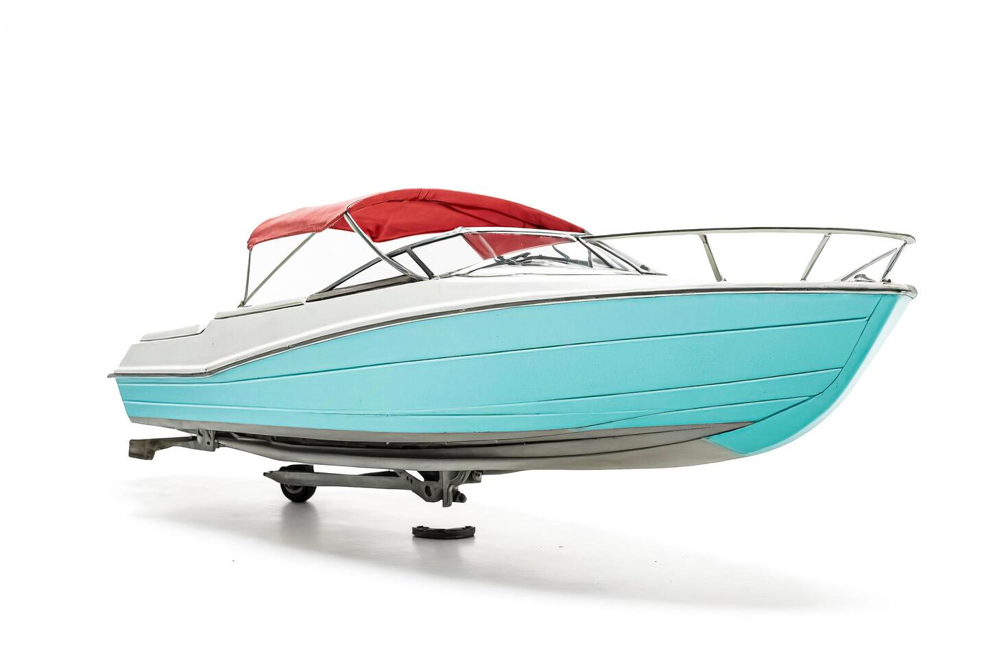 Blue and White Speedboat on Trailer photo