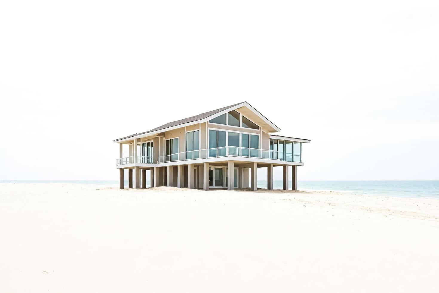 Beachfront House with White Sand and Ocean photo