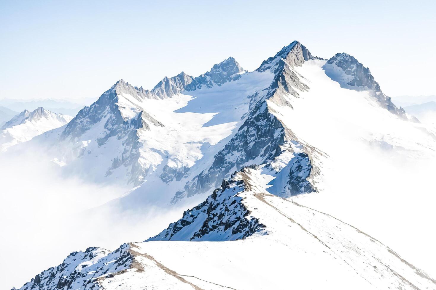 Snow-Capped Mountain Peaks in the Swiss Alps photo