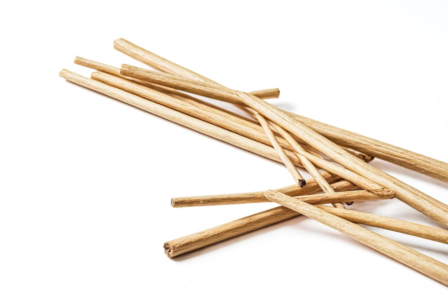Natural wooden sticks isolated on white background photo
