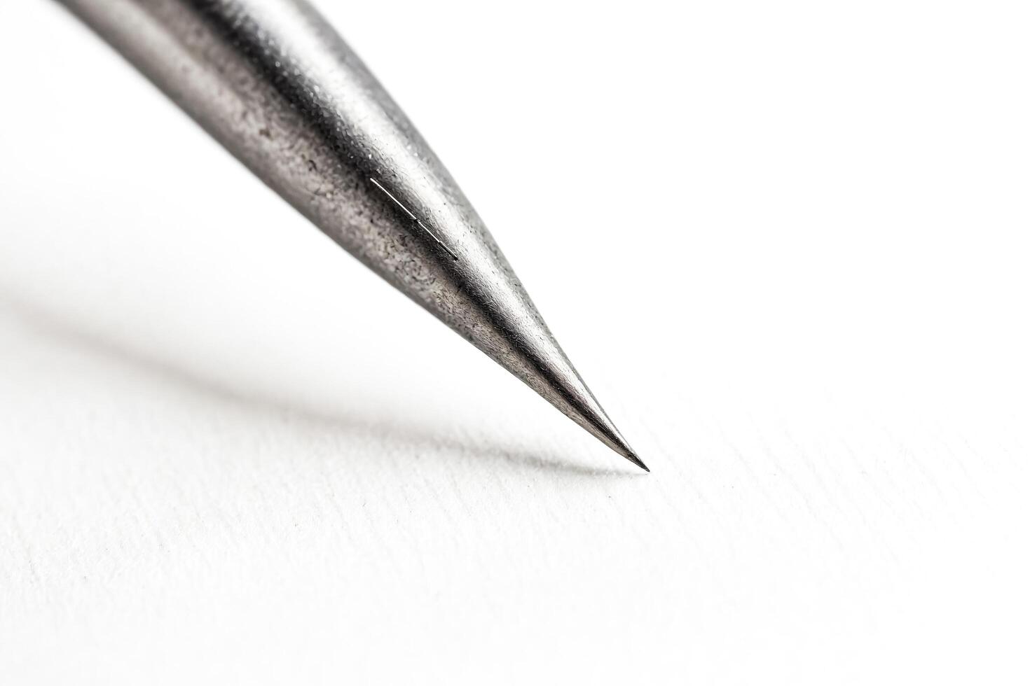 Closeup of a sharp metal needle point photo