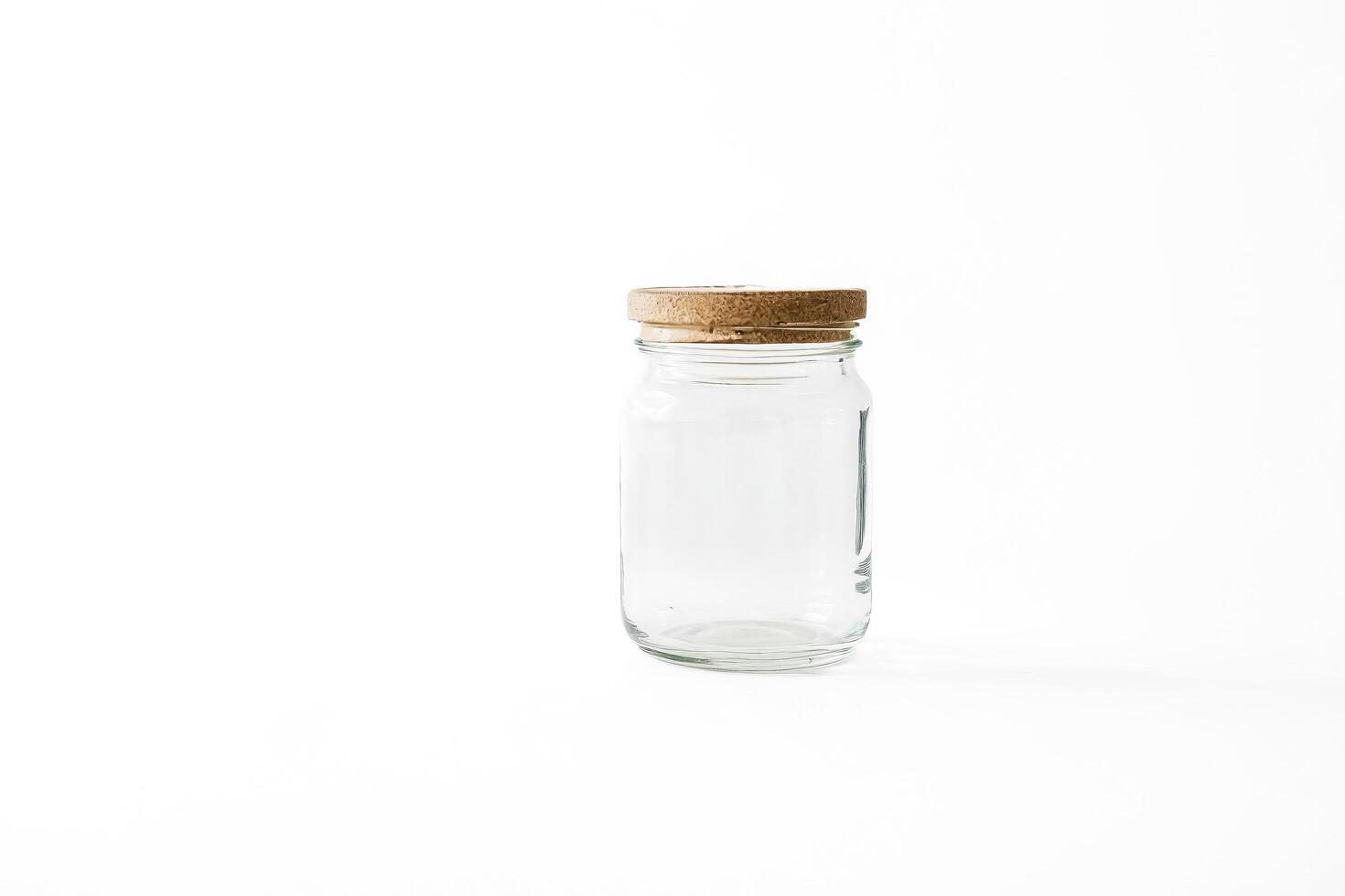 Empty Glass Jar with Cork Lid on White Background photo
