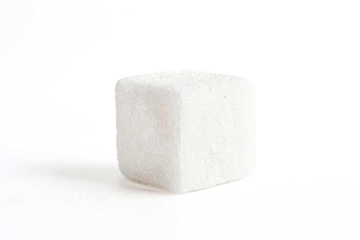 Single Sugar Cube Isolated on White Background photo