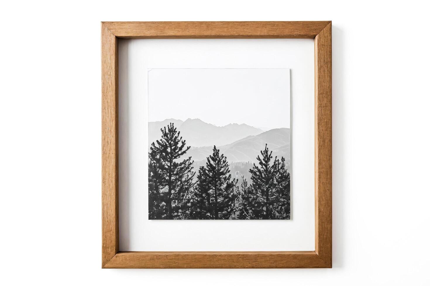 Framed Black and White Photo of Mountains and Pine Trees