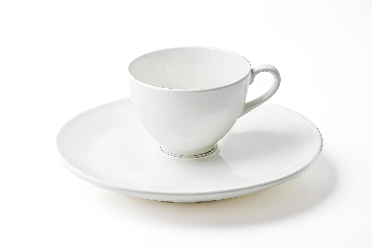 Empty white cup and saucer photo