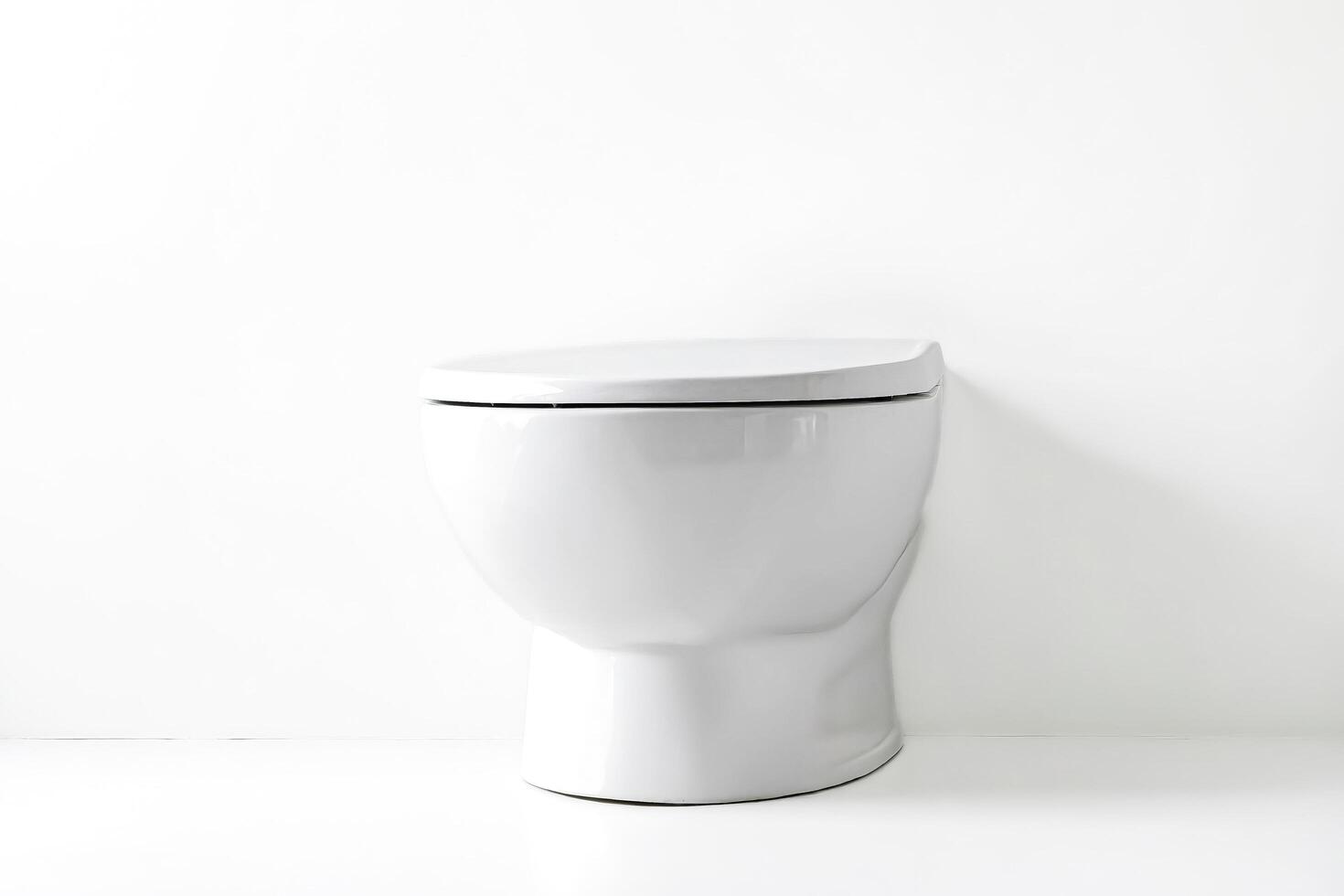White toilet bowl in a white bathroom photo