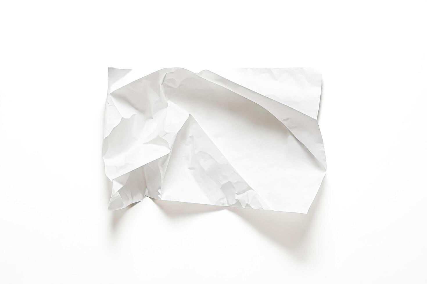 Crumpled white paper on white background photo