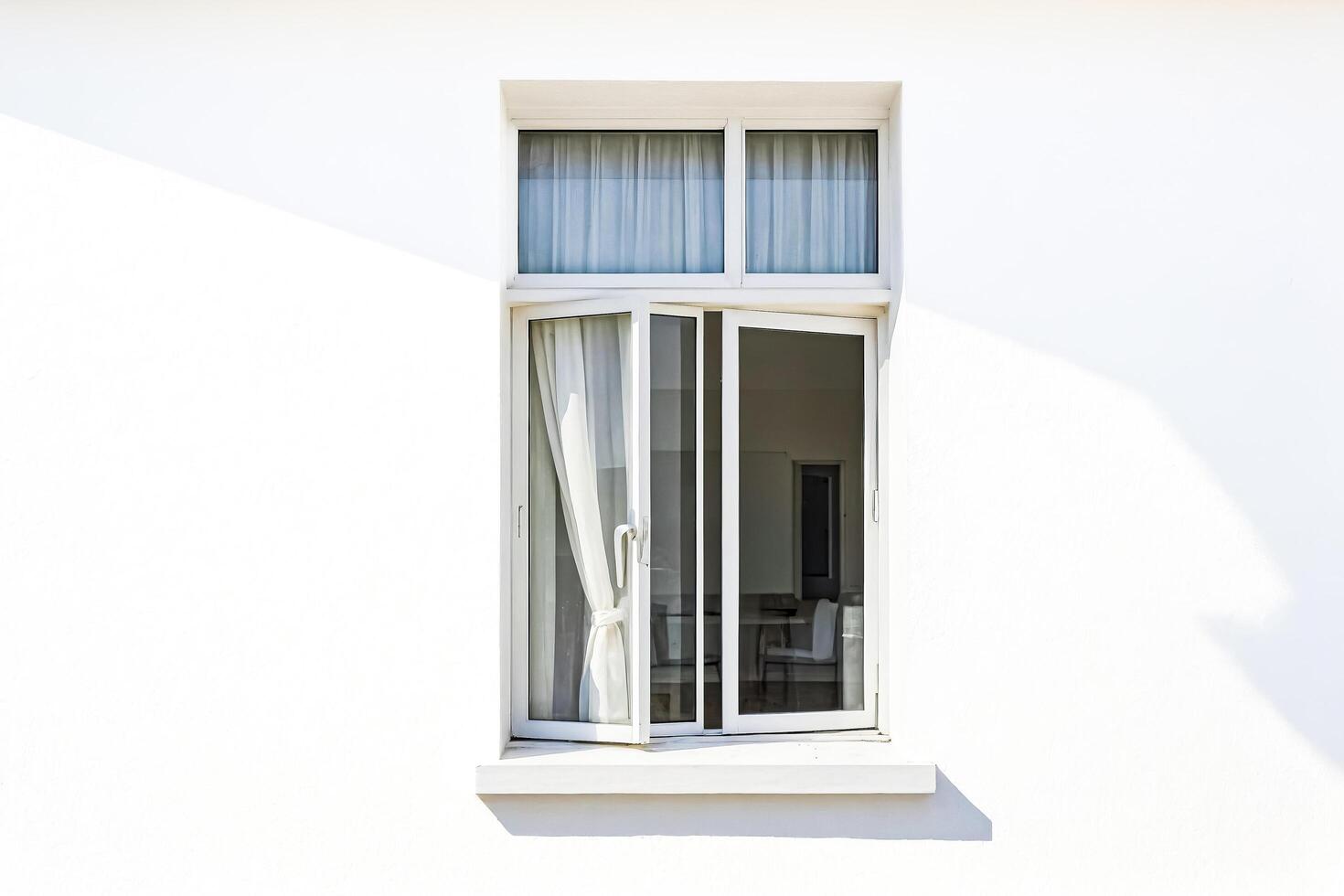 White Window with Sheer Curtains on White Wall photo