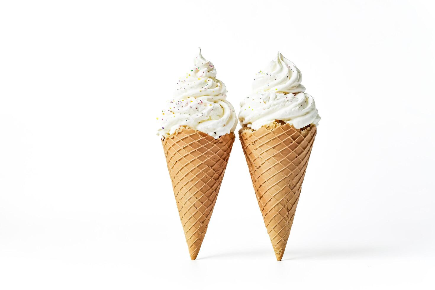 Two Ice Cream Cones with Sprinkles on a White Background photo