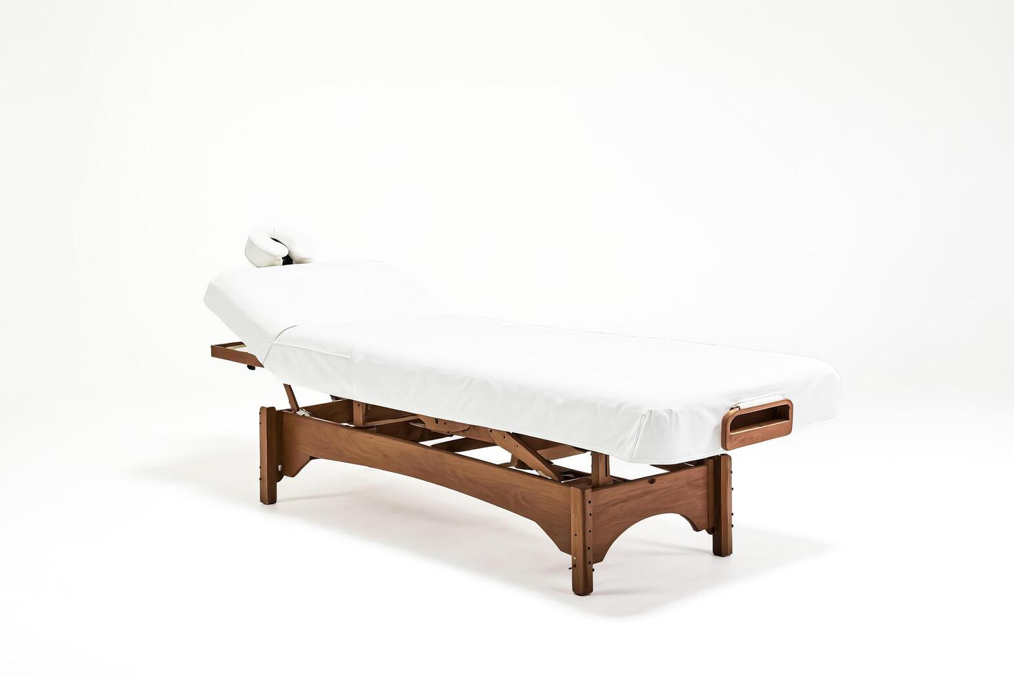 Wooden Massage Table with White Sheet photo