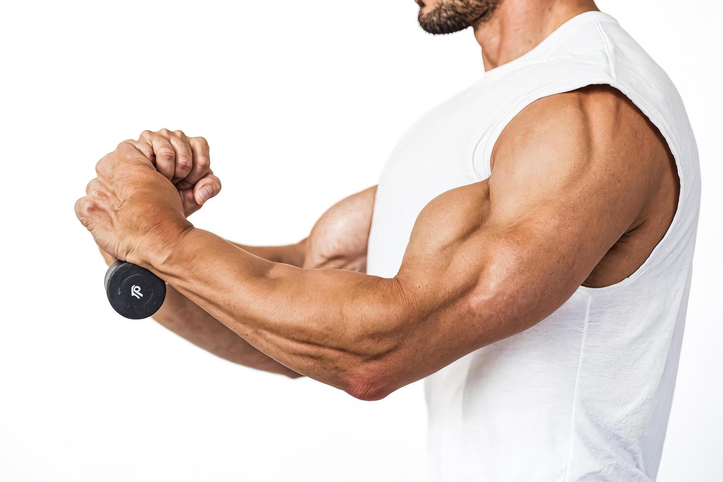 Closeup of Muscular Male Arm Lifting a Dumbbell photo