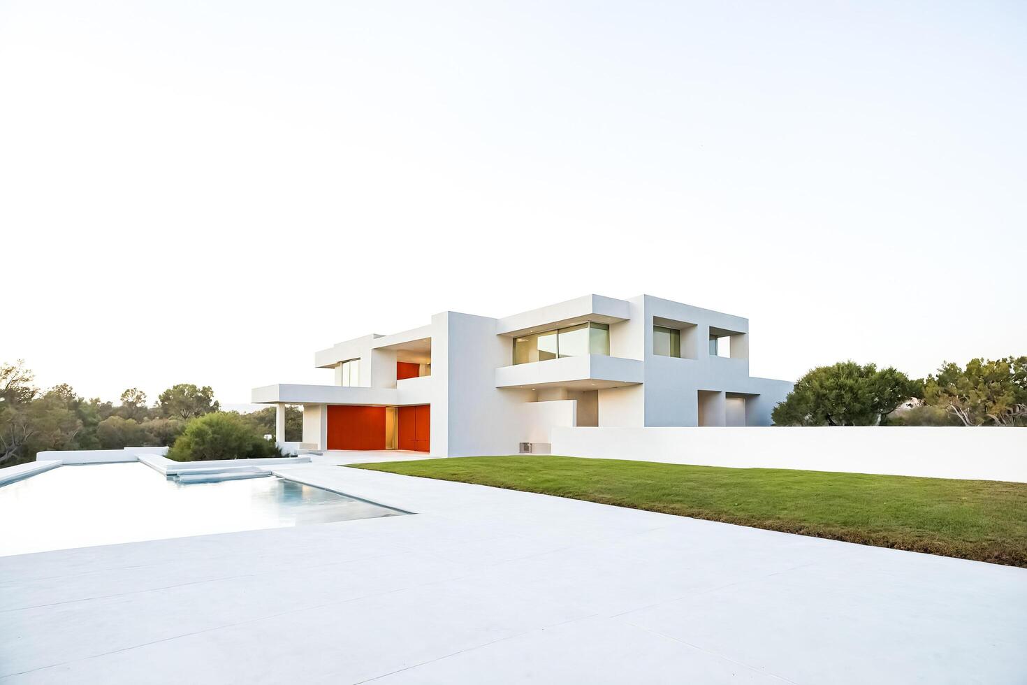 Modern villa with swimming pool and lush green lawn photo