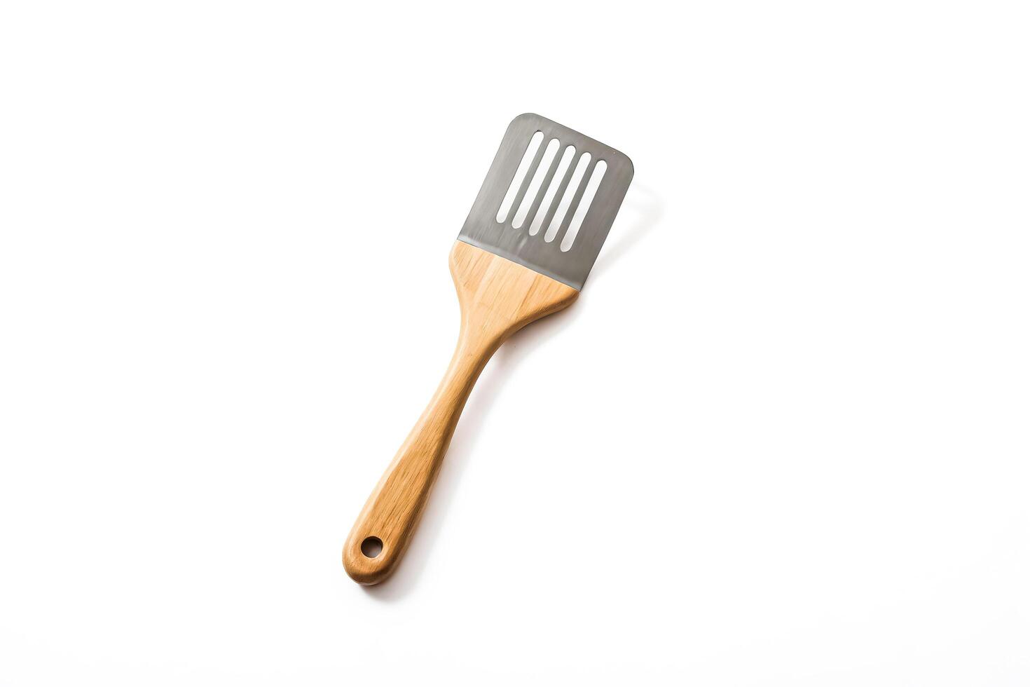 Wooden Handle Spatula on White Background photo