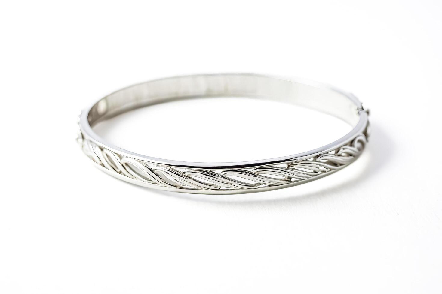 Silver bangle bracelet with intricate design photo