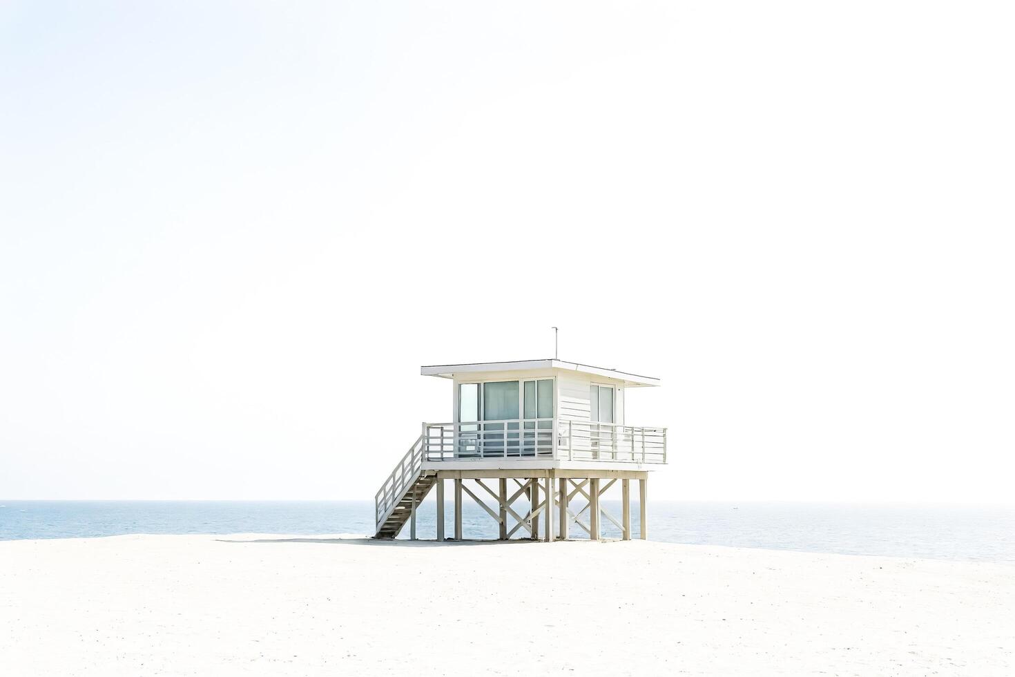 White Lifeguard Stand on a Beach photo