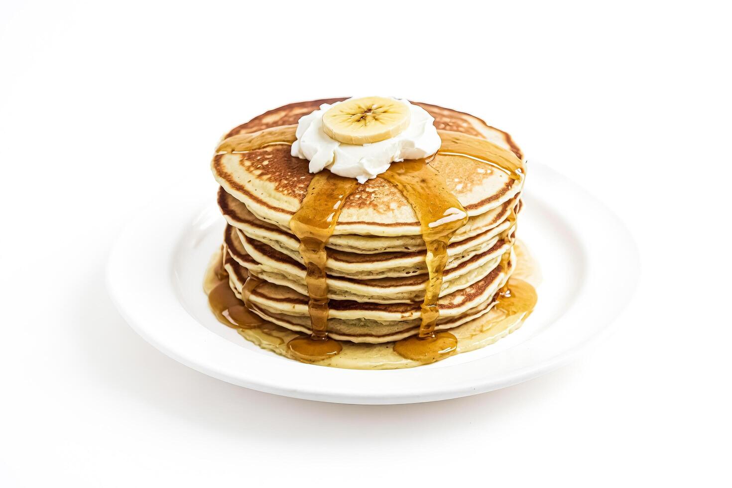 Stack of Pancakes with Banana and Whipped Cream photo