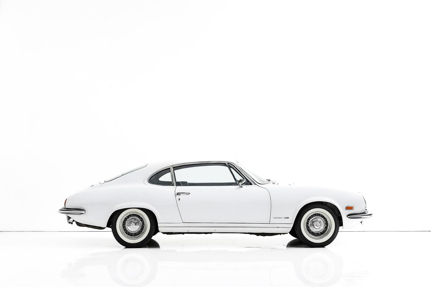 White Classic Coupe Car on White Background photo