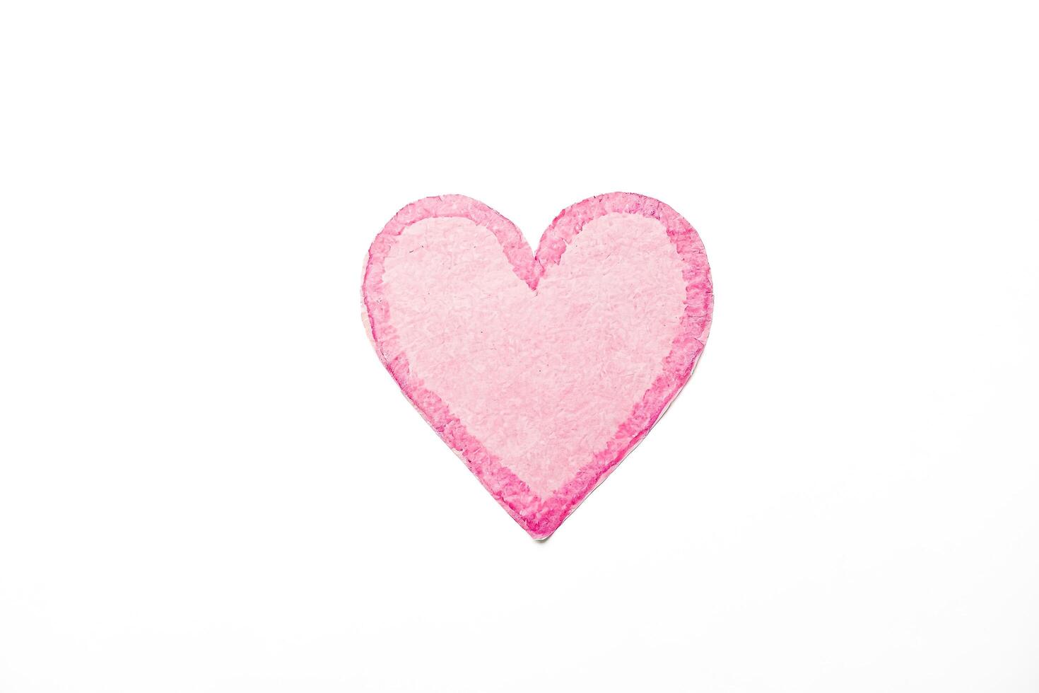 Pink Heart Paper Cutout on White Background photo