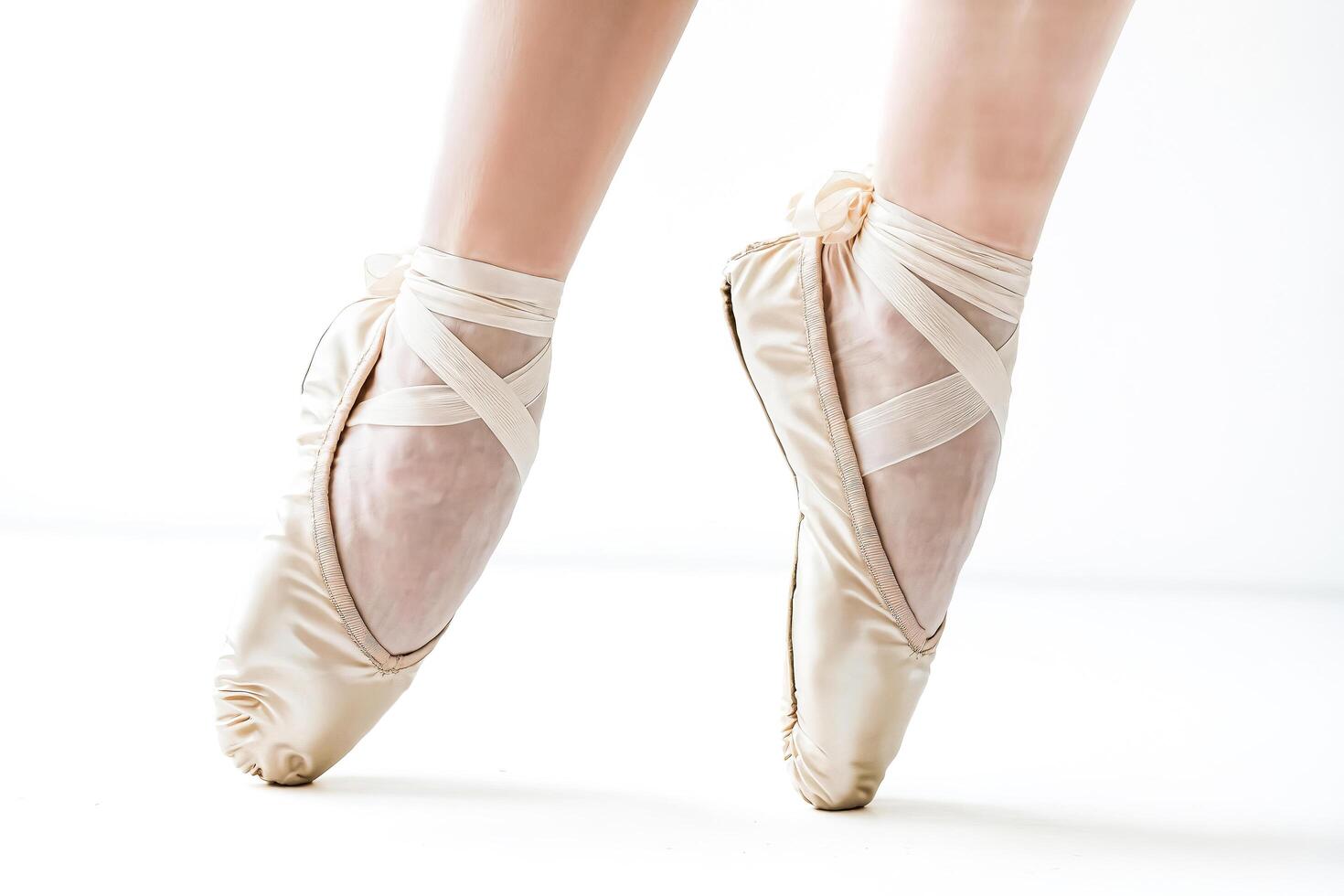 Close Up of Ballerina's Feet in Pointe Shoes photo