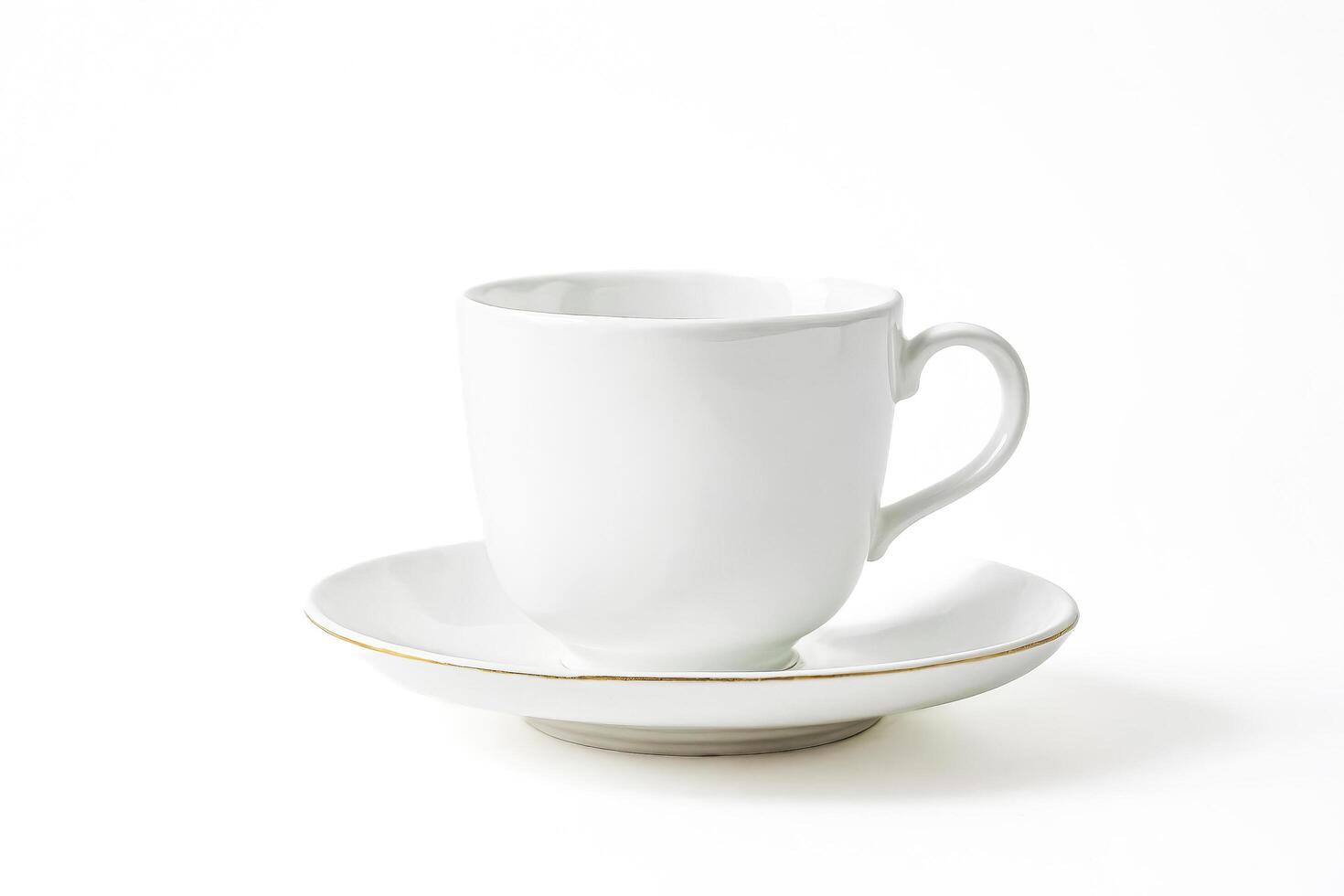 White Coffee Cup and Saucer with Gold Trim photo