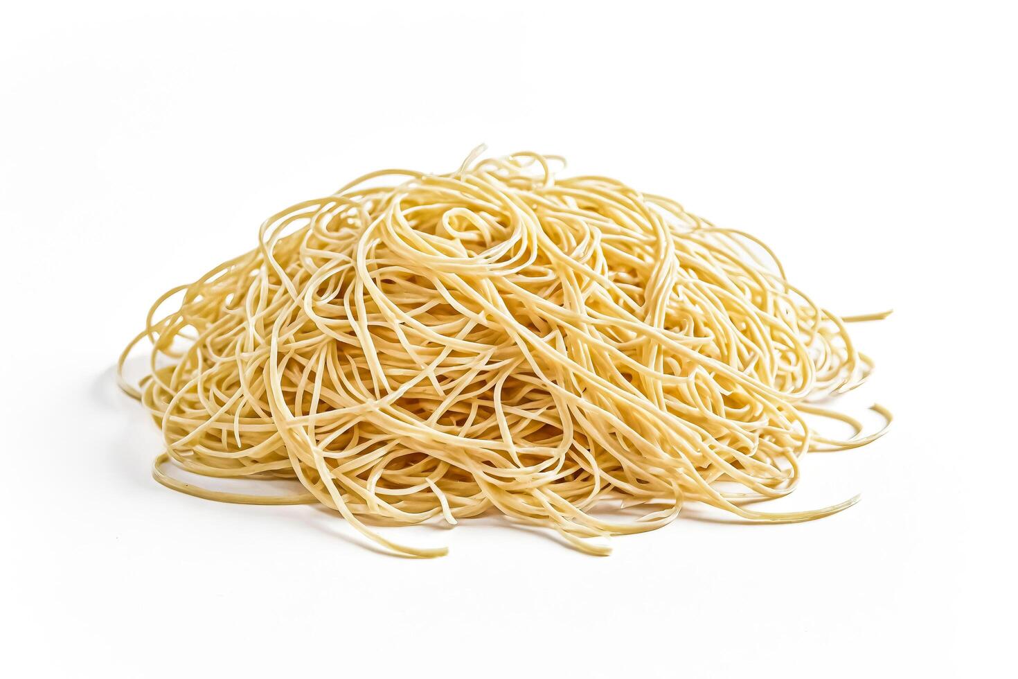 Uncooked Spaghetti on White Background photo