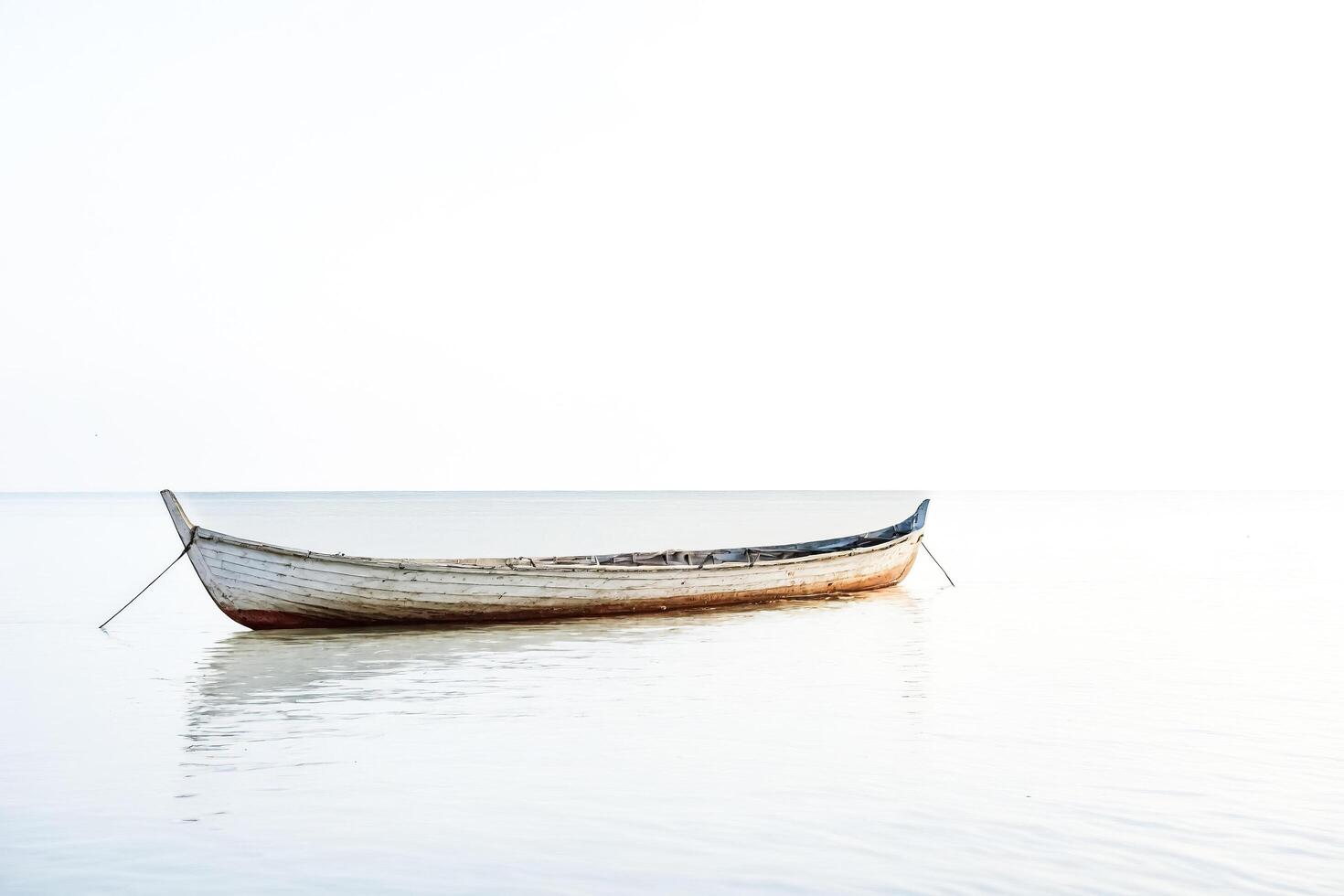Lonely Boat on Calm Sea photo