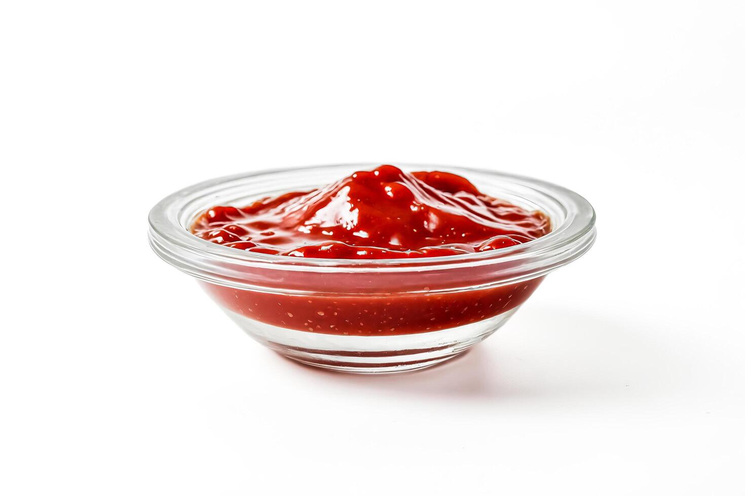 Small Glass Bowl of Ketchup on a White Background photo