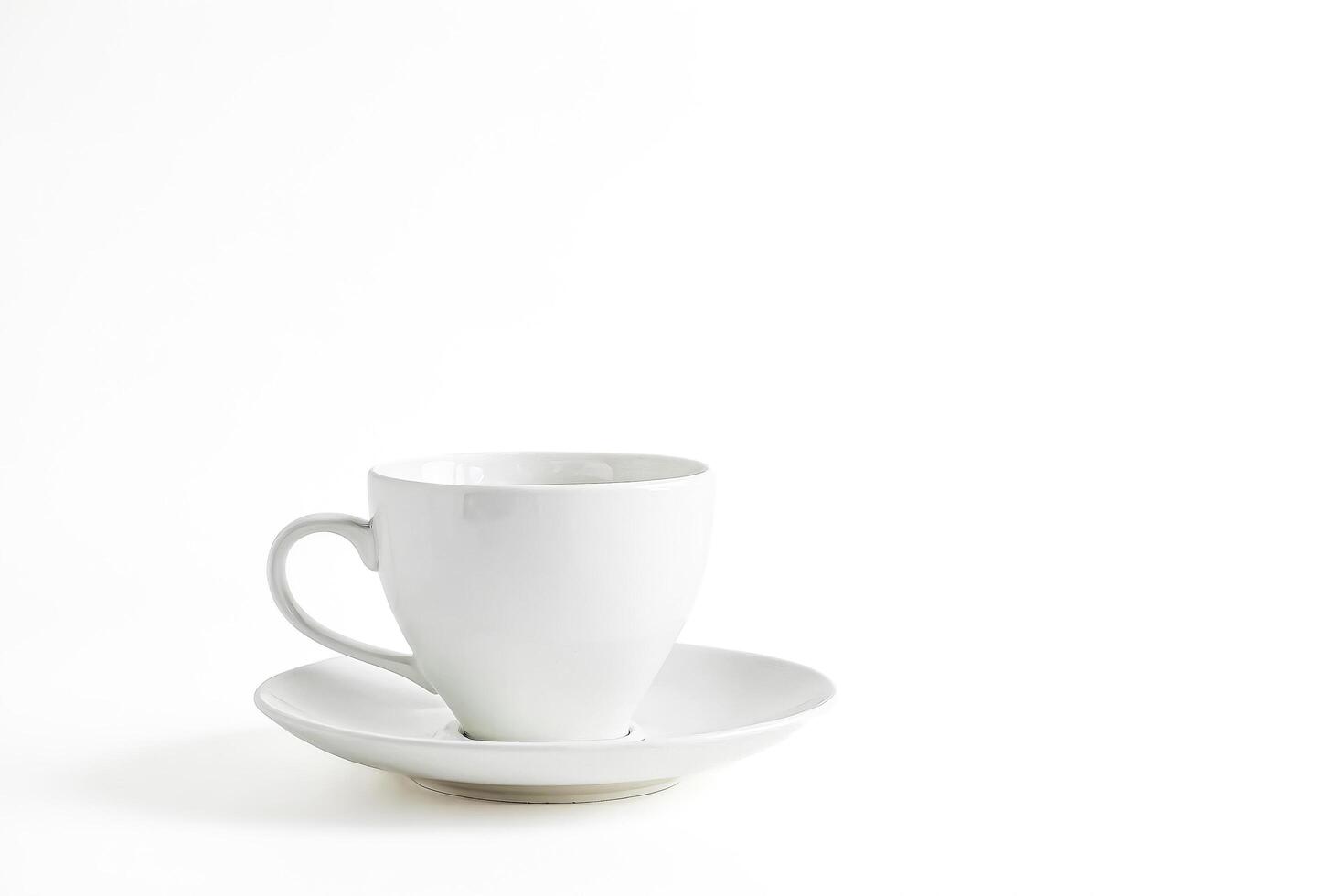 White Coffee Cup and Saucer on White Background photo