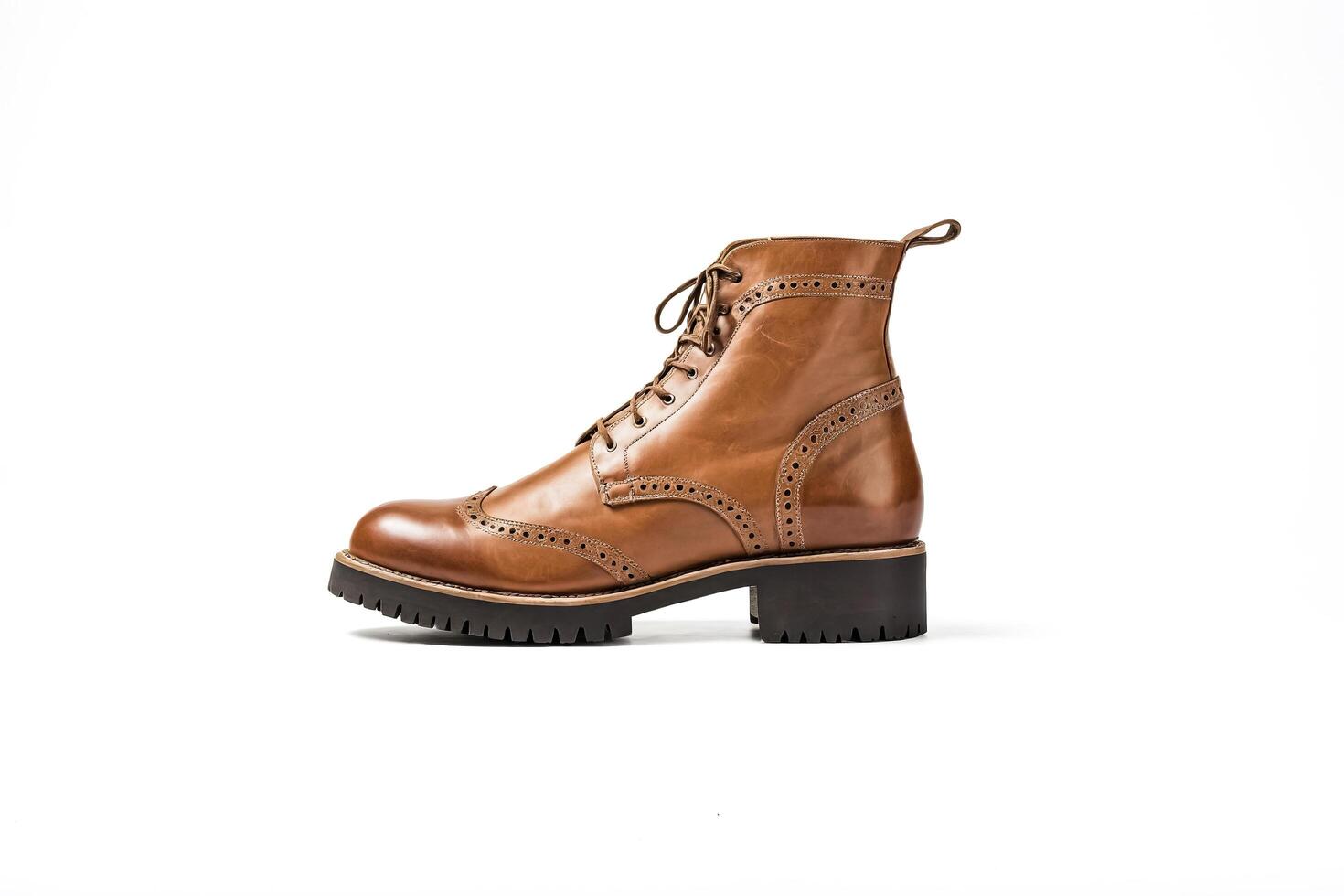 Brown Leather Brogue Boot with Laces on White Background photo