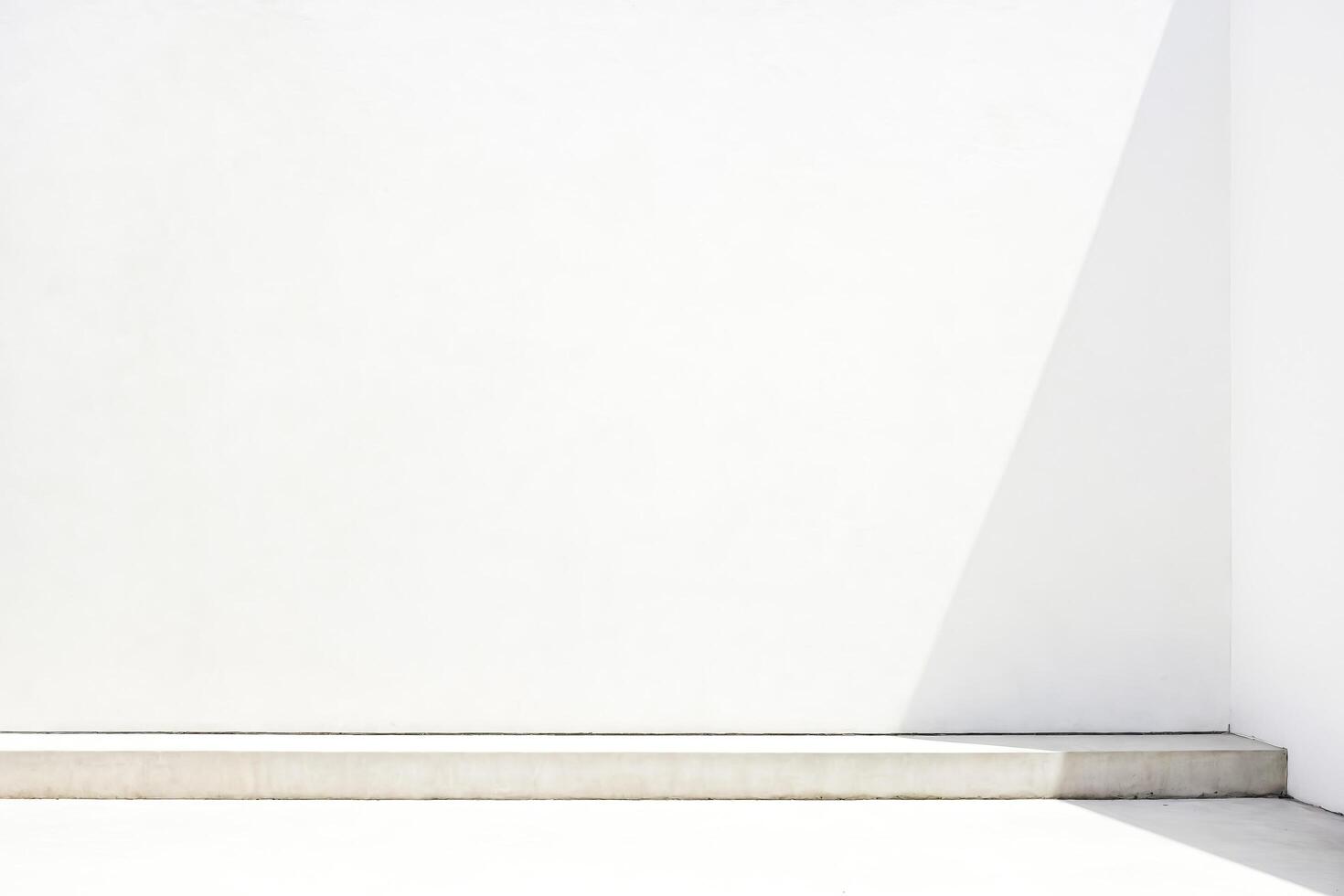 Minimalist White Corner with Concrete Shelf photo