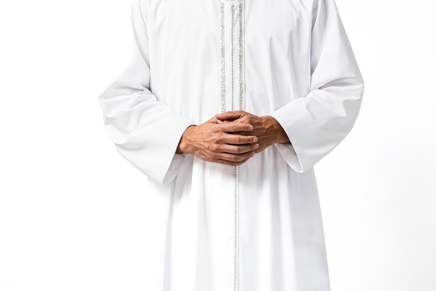 Man in White Robe with Hands Clasped photo