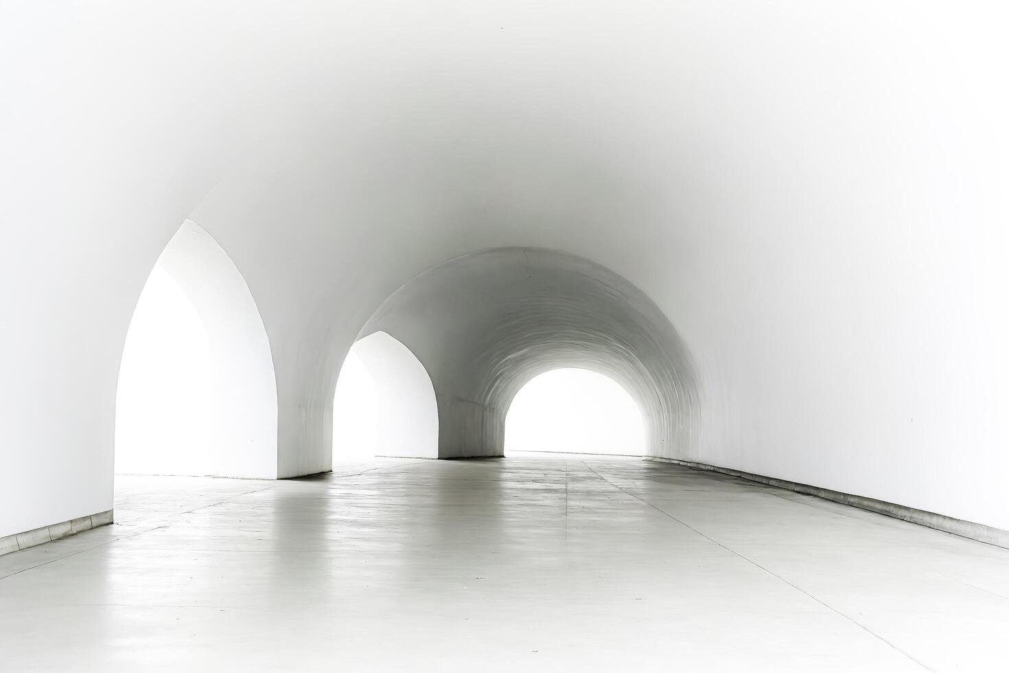 White Arched Tunnel with Concrete Floor photo