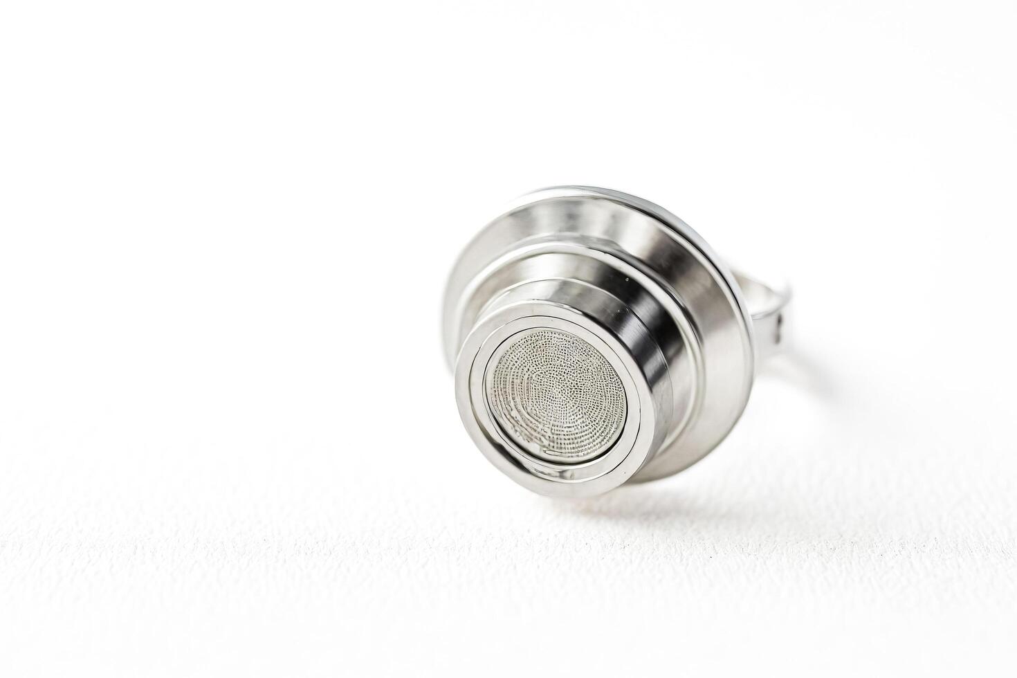 Close up of a silver ring on a white background photo