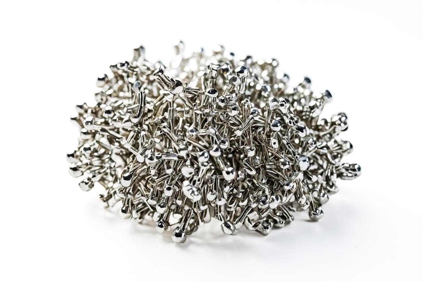 Close-up of a cluster of silver metallic stick figures photo