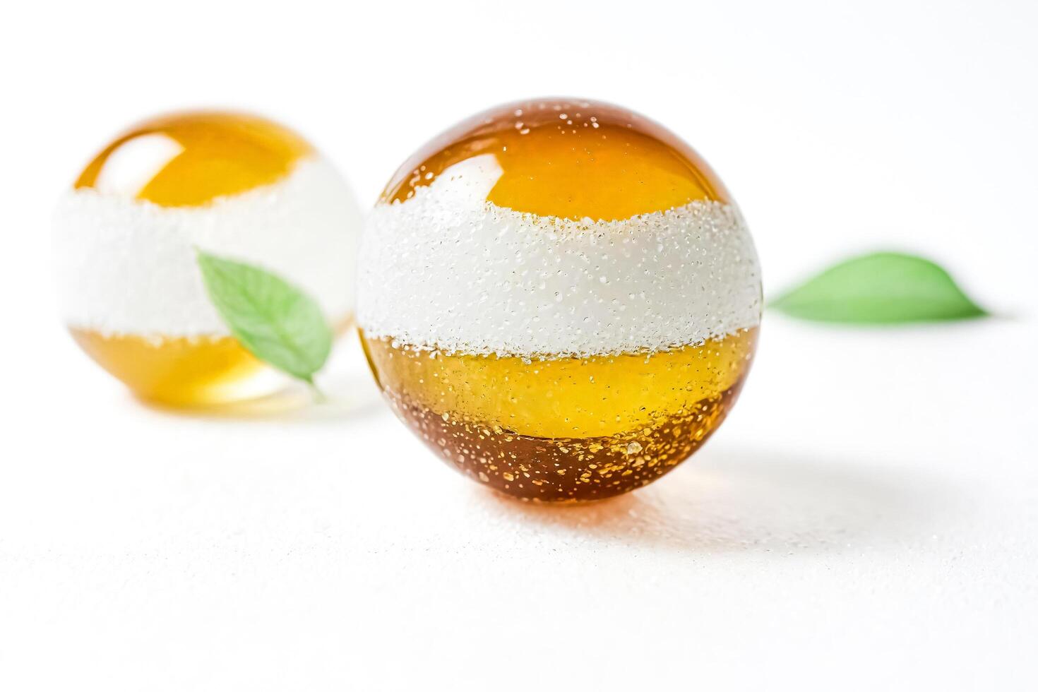 Two Golden Glass Balls with White Accents photo