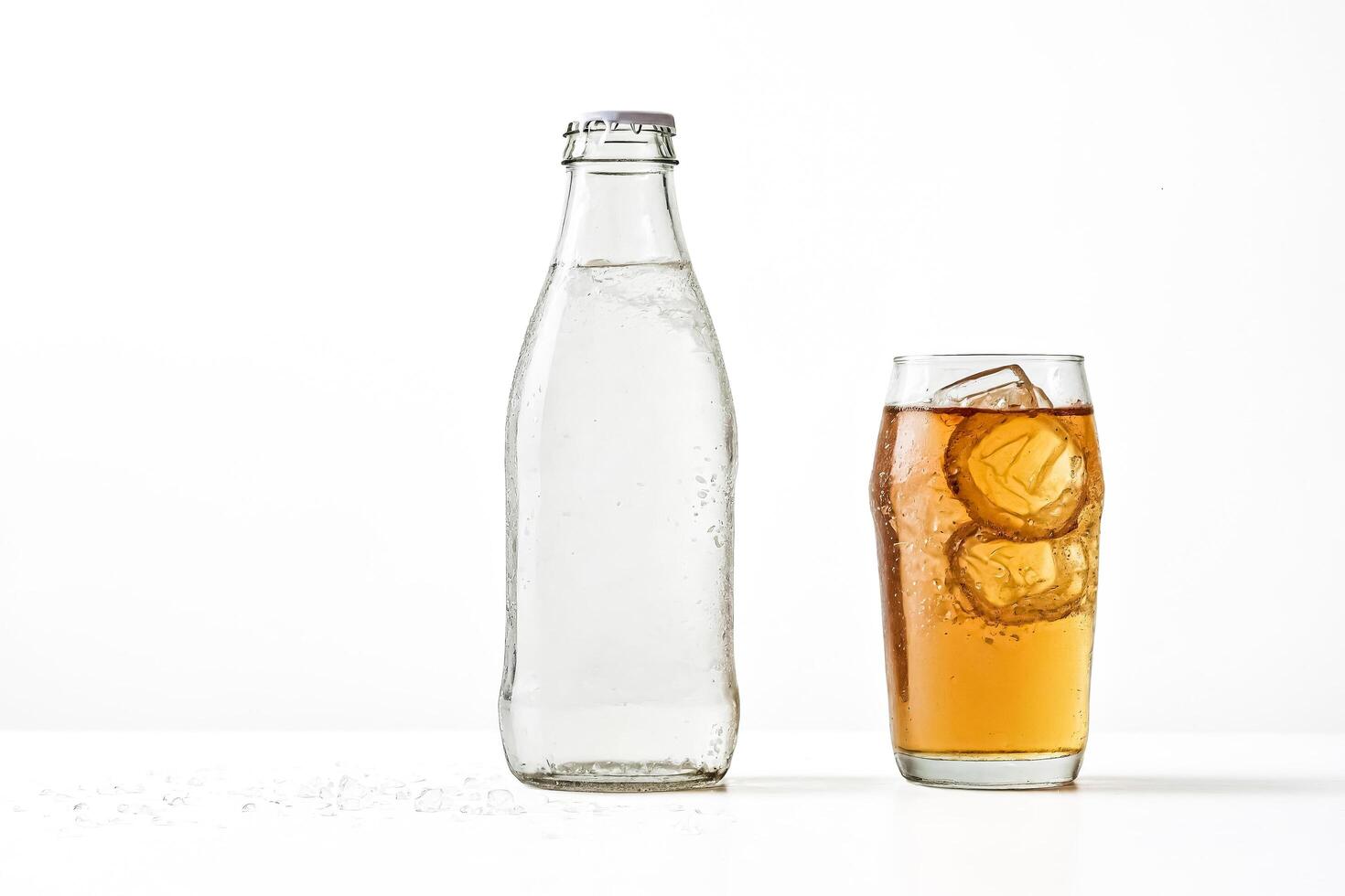 Iced Tea in a Glass with a Bottle of Water photo