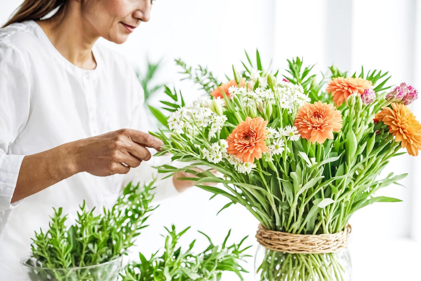 Woman Arranging Beautiful Bouquet of Flowers photo