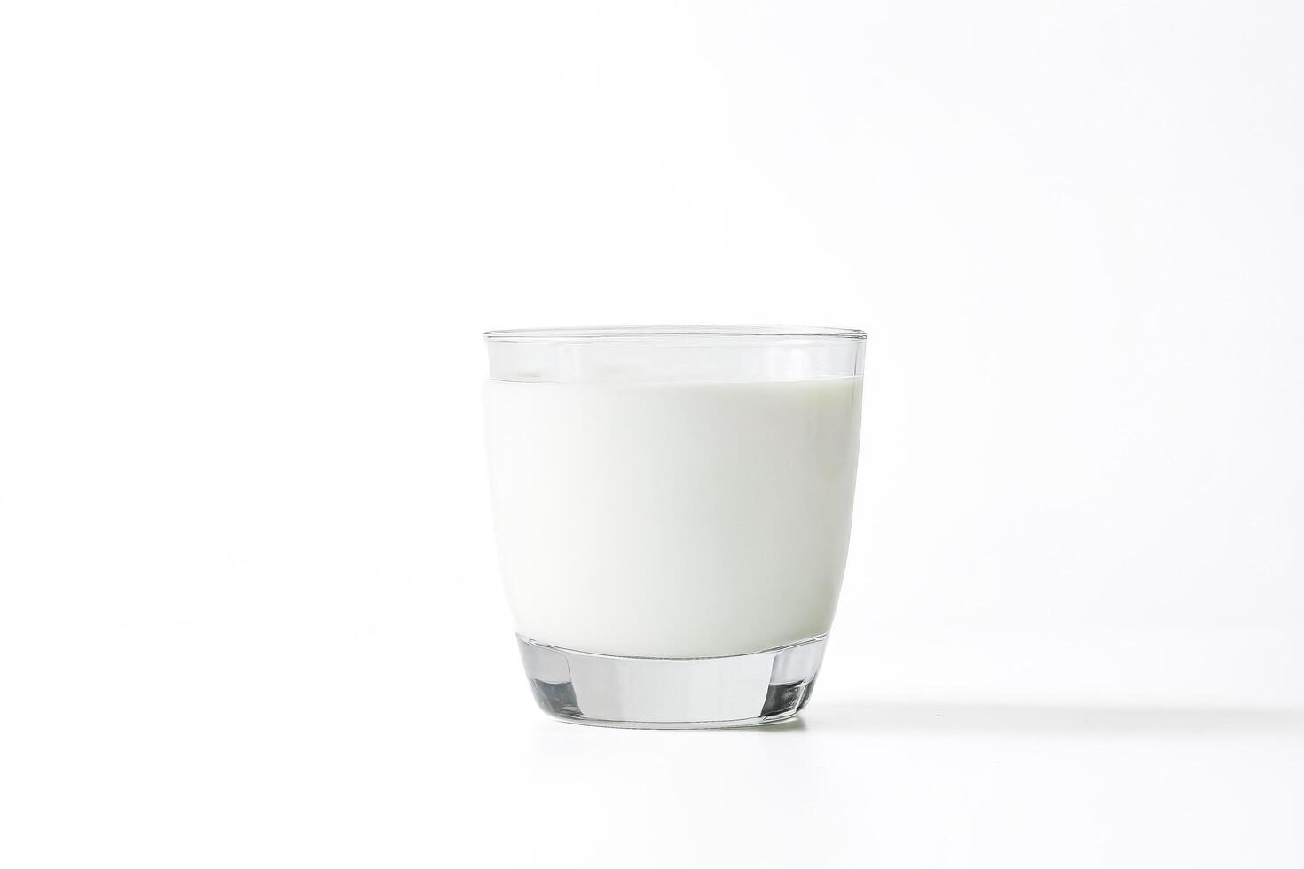 Glass of Milk on White Background photo